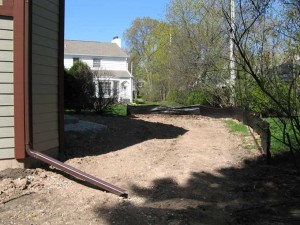 Prior to construction, the backyard was a bleak, desolate and undesirable space with very little privacy for the Owners.  The only valuable existing condition was an arborvitae hedge and large lilac that helped to buffer the existing white house to the north.  These valuable shrubs were protected and saved as a landscape screen for privacy.