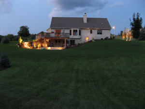 Landscape lighting allows the Owners to utilize their deck and patio after sunset for evening entertaining. Special emphasis is given to accenting the steps and patio to provide safe access through the space. Uplighting on trees enhances the beauty of the trees and defines the edges of the property. The landscape lighting creates an enhanced pleasant composition to the nightscape.